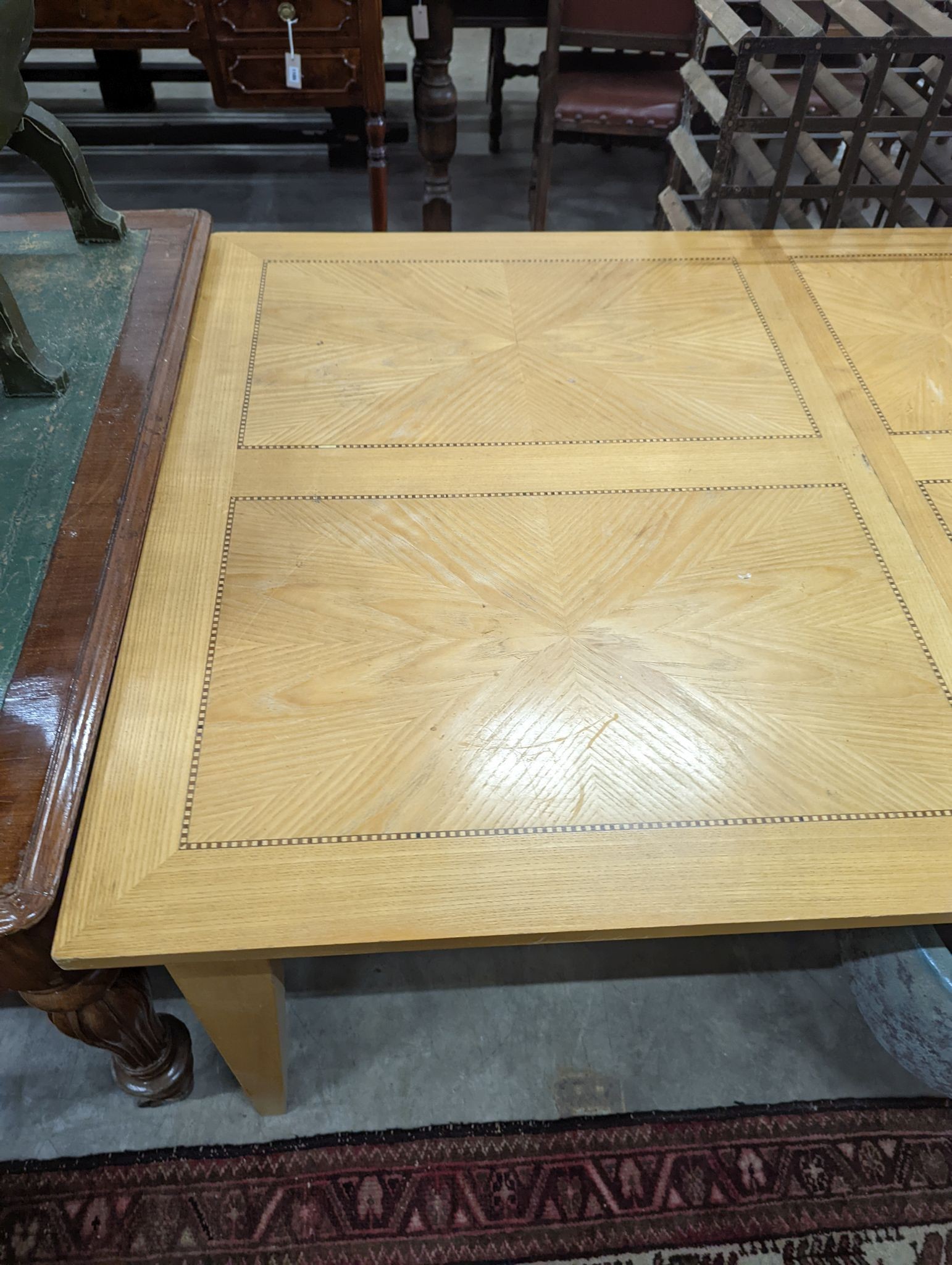 A contemporary inlaid oak extending dining table, 237cm extended, width 107cm, height 75cm